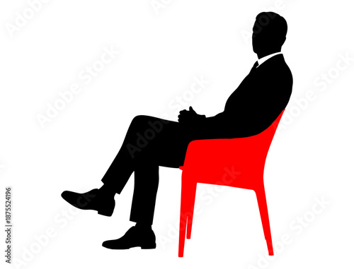 silhouette of a man sitting on a chair