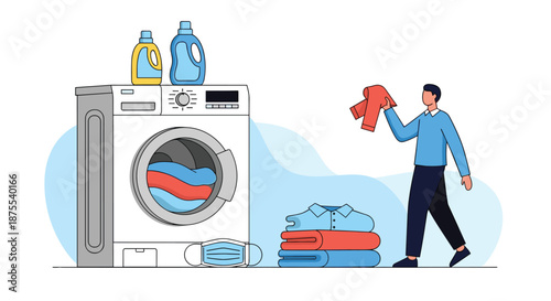 Man doing laundry at home, standing next to a washing machine with detergent and a stack of clean, folded clothes.