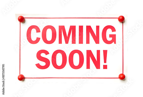 Coming soon sign with red text and push pins