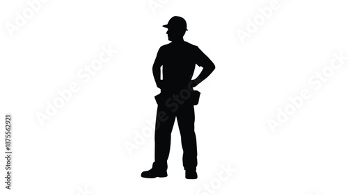 Confident construction worker standing with hands on hips in hard hat