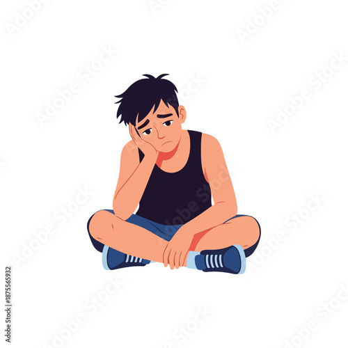 Sad young man sitting on the floor feeling depressed and lonely.