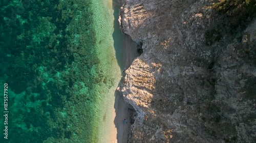 Top Down Drone Flight Along Spiaggia di Sansone Beach – Turquoise Water and Rocky Coastline, Elba Island Italy