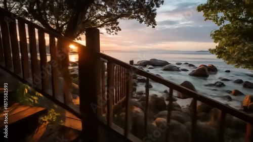 Wooden staircase leading to beach at sunset with scenic coastal view