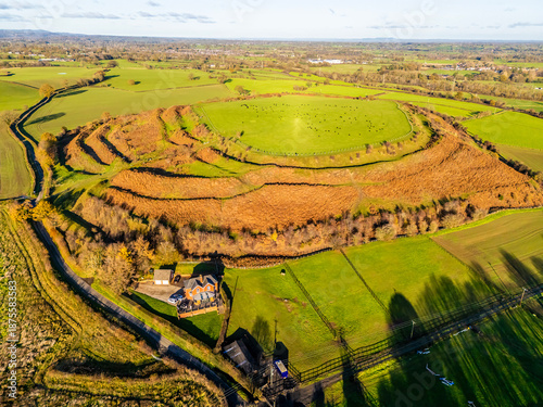 Photography An aerial view towards the south side of Old Oswestry fort and surrounding count