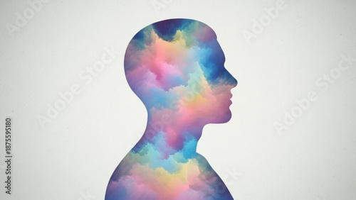 Vibrant silhouette of a human head in profile with a colorful abstract cloudy pattern filling the shape