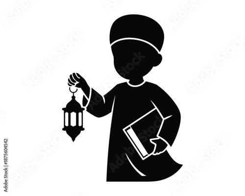 Muslim boy holding a traditional lantern and a book Happy Ramadan Mubarak concept 