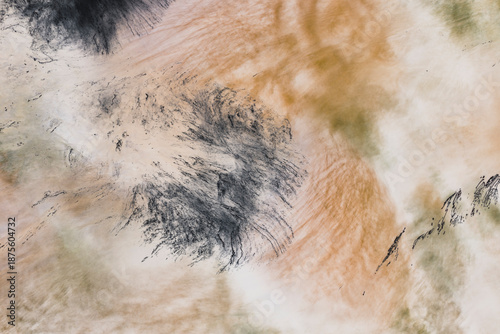 Long exposure of moving water, churning and flowing, surface highlights, impressionistic blurred effect. 