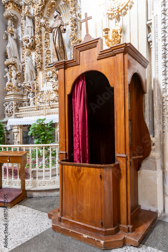 Fotografie Ancient wooden confessional in a Church a in Lecce