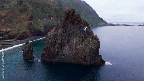 Winding drone shot capturing coastal cliffs and scenic hills