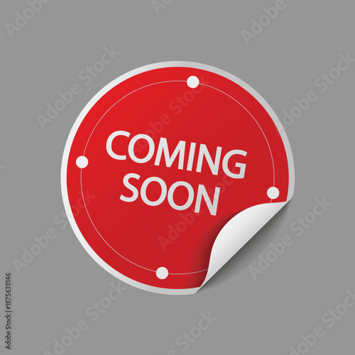 Glossy red coming soon circle sticker with peeled corner effect and dotted border on gray background
