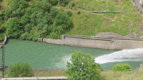 High-Pressure Water Release at Monts d'Orb Dam: Controlled Reservoir Discharge in France.