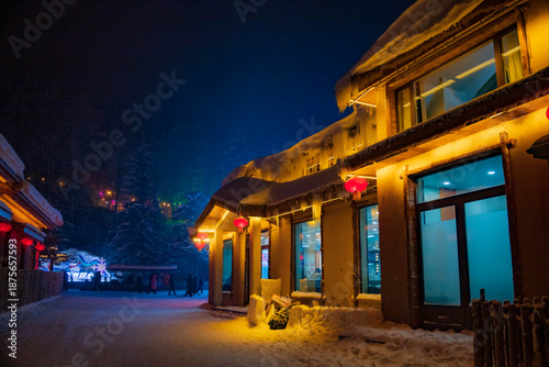 Snowy winter festival night market at  Xuexiang China snow town.