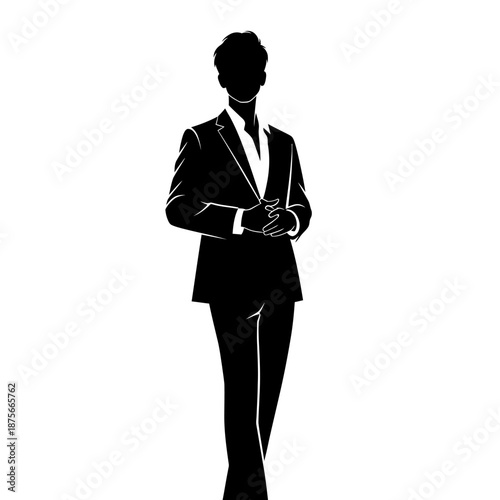 Man in Suit Standing with Hands Clasped.