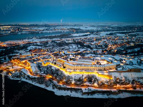 Aerial Sunset View of Petrovaradin Fortress Covered in Snow over the Danube River, Novi Sad, Serbia
