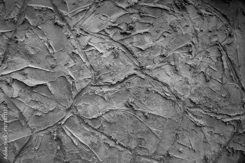 gray background, in the photo the texture of a gray wall with various lines, strokes and cracks