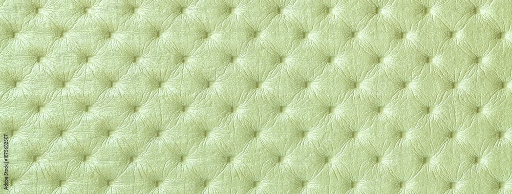 Fototapeta premium Pastel green leather texture with capitone pattern, macro background of olive retro Chesterfield vintage textile fabric