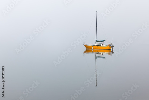 Yellow Sailboat in the Fog