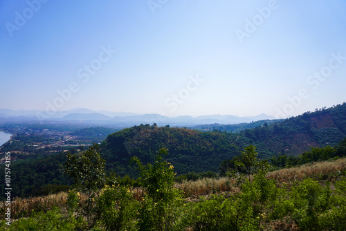 Scenic Landscape of Rolling Hills and Blue Sky in Daylight