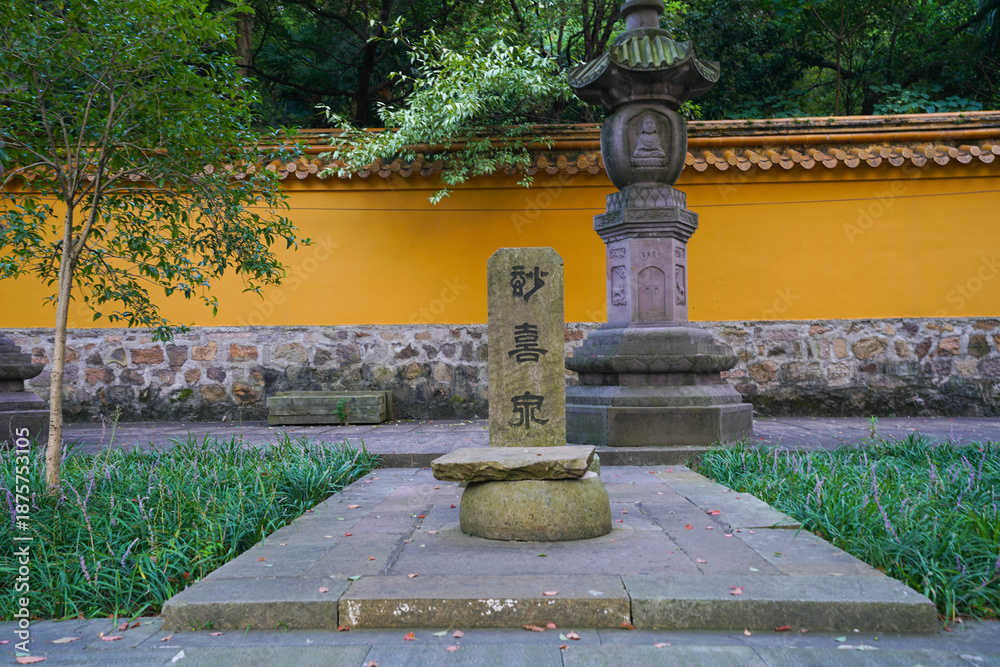 Fototapeta premium Buddhist Temple Garden, Ningbo - Stone Monuments and Yellow Wall