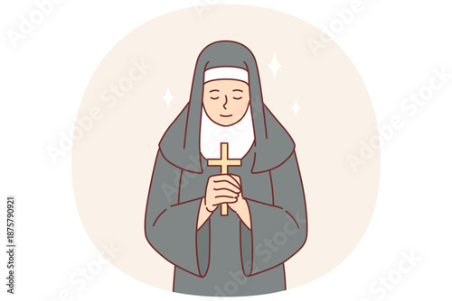 Nun praying holding catholic cross in hands and bowing to god, dressed in cassock