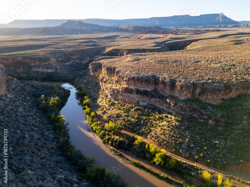 Obraz na plátne Aerial views capture the winding Virgin River as it carves through deep red sandstone canyons near Hurricane, Utah