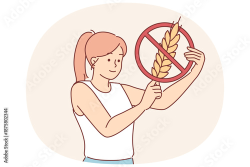 Woman holds gluten-free sign, urging people to stop eating foods containing grains and wheat