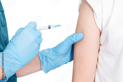 Quadro em tela Isolated close up of nurce or doctor hands in blue gloves give injection to little sick child patient, scheduled for vaccination in clinic, healthcare concept