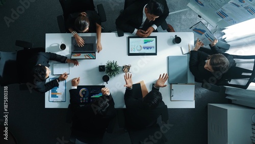 Foto Top down aerial view of investor handed financial document to manager while explain marketing idea at meeting table