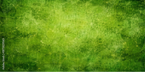 A textured green grass grunge background features an aged vintage paper pattern with a dirty antique surface and retro parchment design