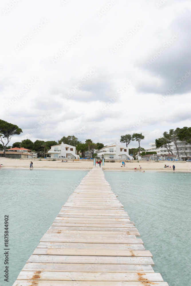Fototapeta premium Wooden pier extending into calm water.. Palma de Mallorca, Spain