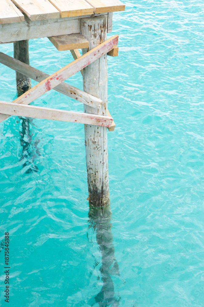 Fototapeta premium Wooden pier above clear turquoise water.. Palma de Mallorca, Spain