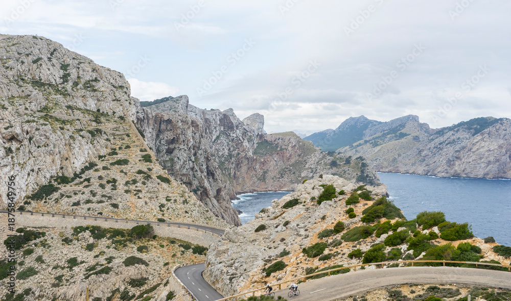 Fototapeta premium Wide view of Cape Formentor viewpoint with blurred tourists and coastline in Mallorca