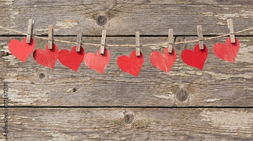 Wallpaper Mural Red paper hearts hanging on clothesline against wood background Torontodigital.ca
