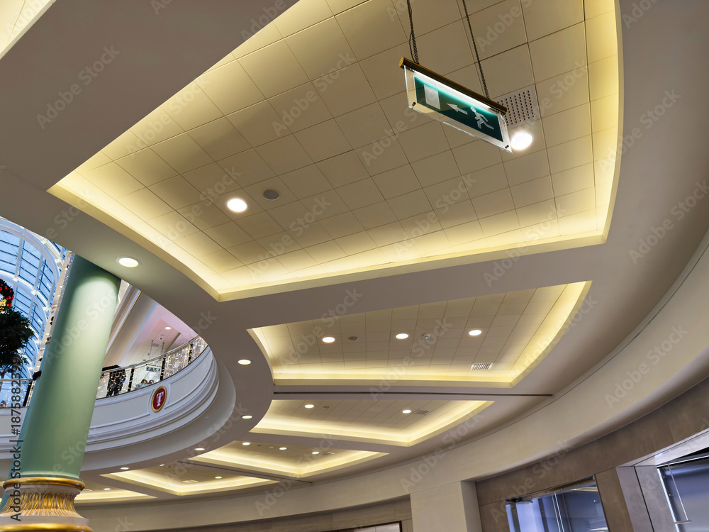 Fototapeta premium Elegant indoor Trafford Centre mall interior with curved ceiling lighting in Manchester UK