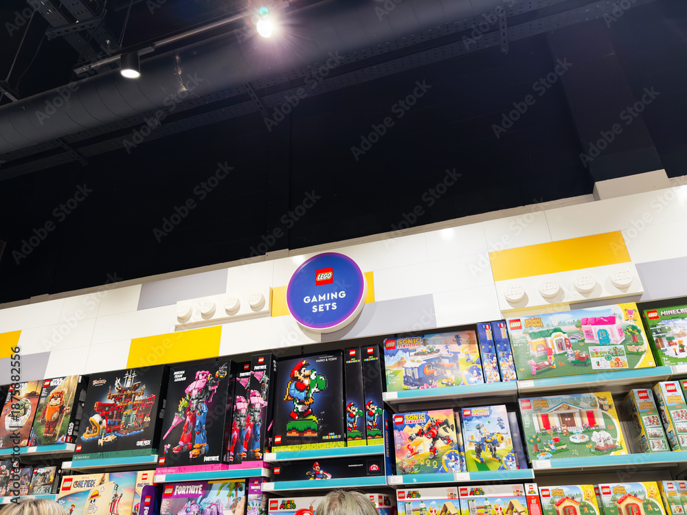 Fototapeta premium Shopping for LEGO gaming sets in a bright Manchester store with colorful boxes on display