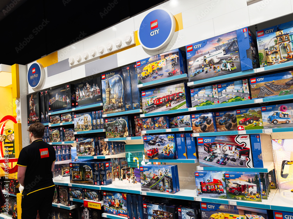 Fototapeta premium Shoppers in a LEGO store in Manchester, UK browsing city themed sets and displays today