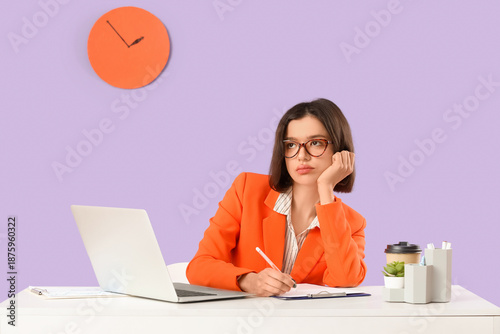 Thoughtful young businesswo...