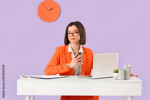 Young businesswoman with co...