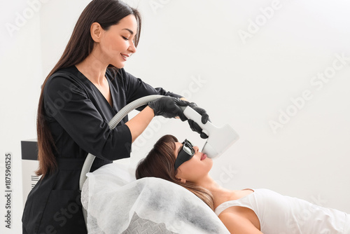 Female cosmetologist perfor...