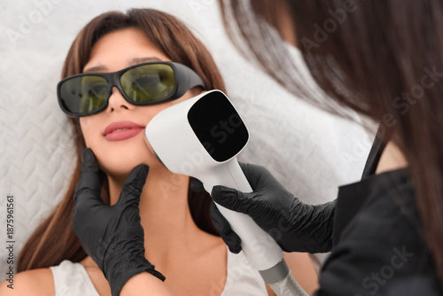 Female cosmetologist perfor...