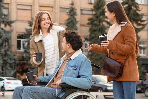 Young man in wheelchair and...