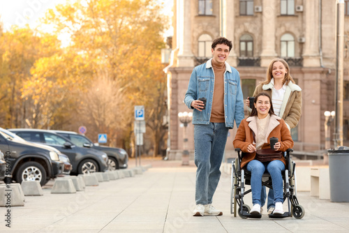 Young woman in wheelchair a...