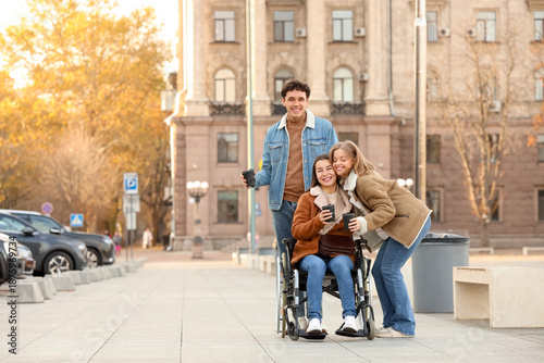 Young woman in wheelchair a...