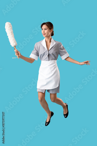 Young female chambermaid wi...