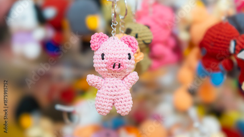 Pink pig keychain hanging on the display. DIY keychain. Back to school stuff.