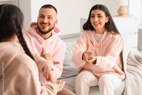 Parents with their little d...