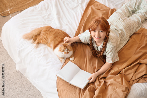 Teenage redhead girl in paj...