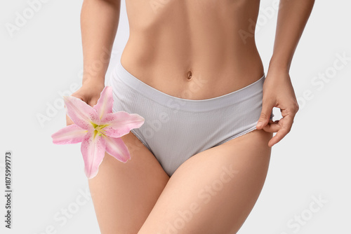 Young woman in panties with...