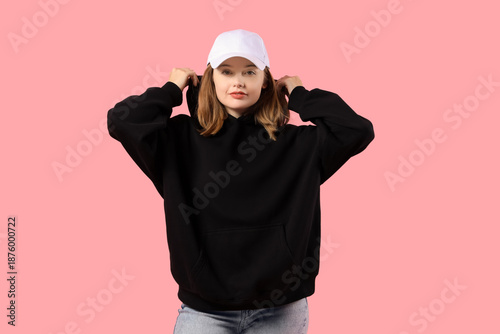 Young woman in black hoodie...