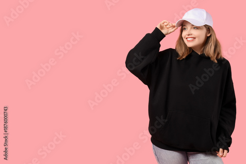 Young woman in black hoodie...